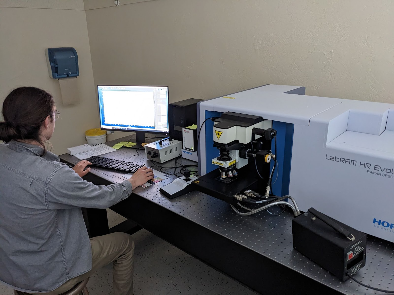 PhD student Dominik Vlaha working in the Raman spectroscopy laboratory.