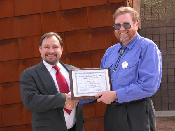 Award received by Ronald L. Lynn and the Clark County Department of Development Services.  Presented by Jonathan G. Price